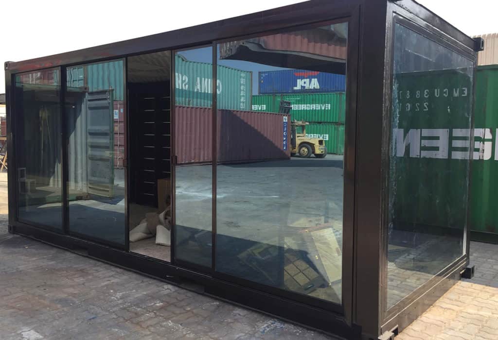 Shipping container conversion with glass windows